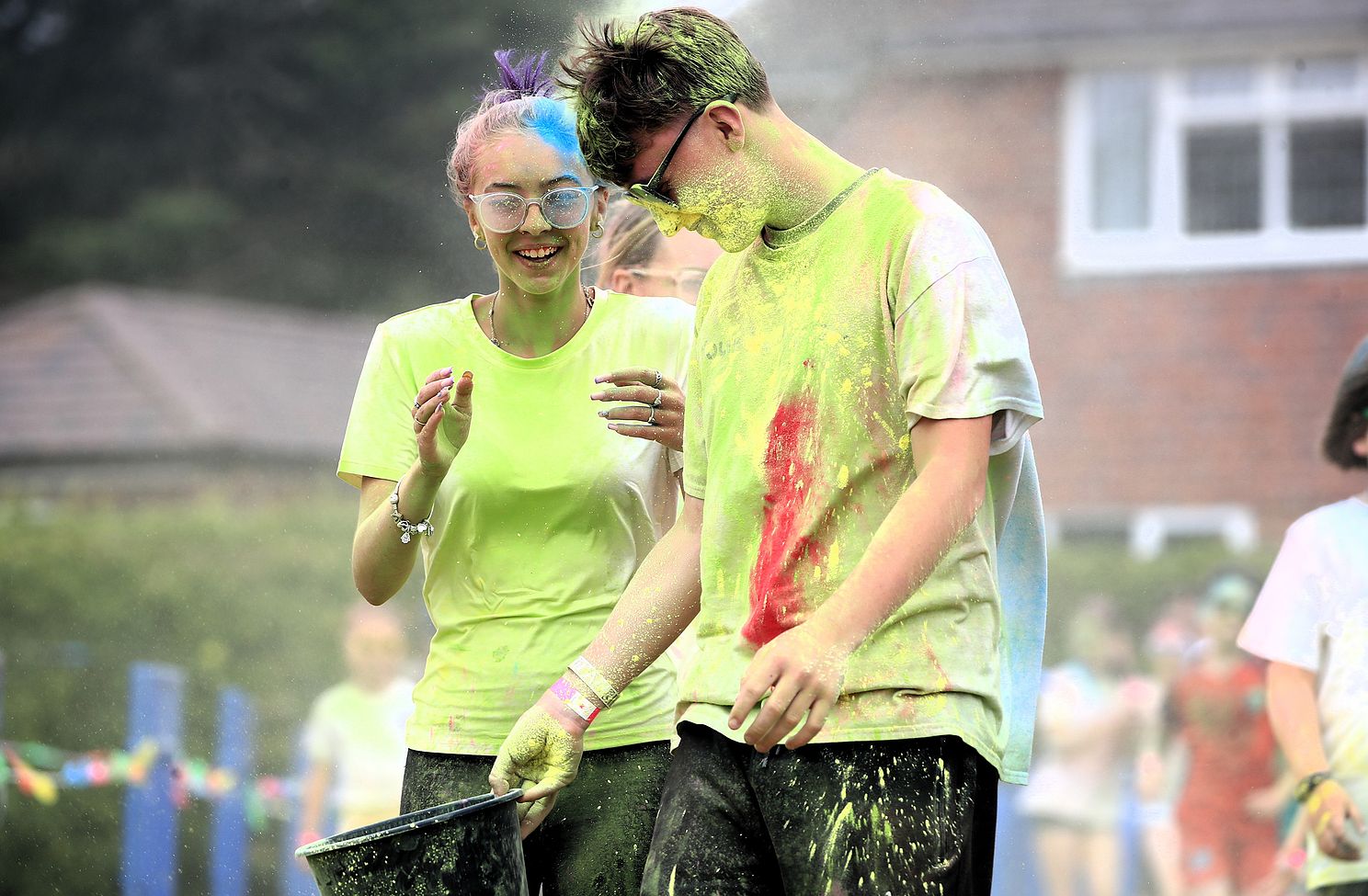 Participants enjoying a colourful community fundraising event